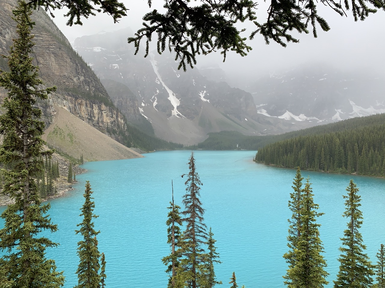 image one in carousel showing a lake surrounded by mountains